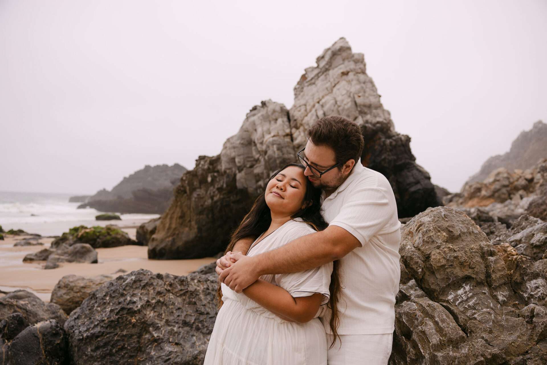 Engagement photographer in Portugal capturing candid beach moments