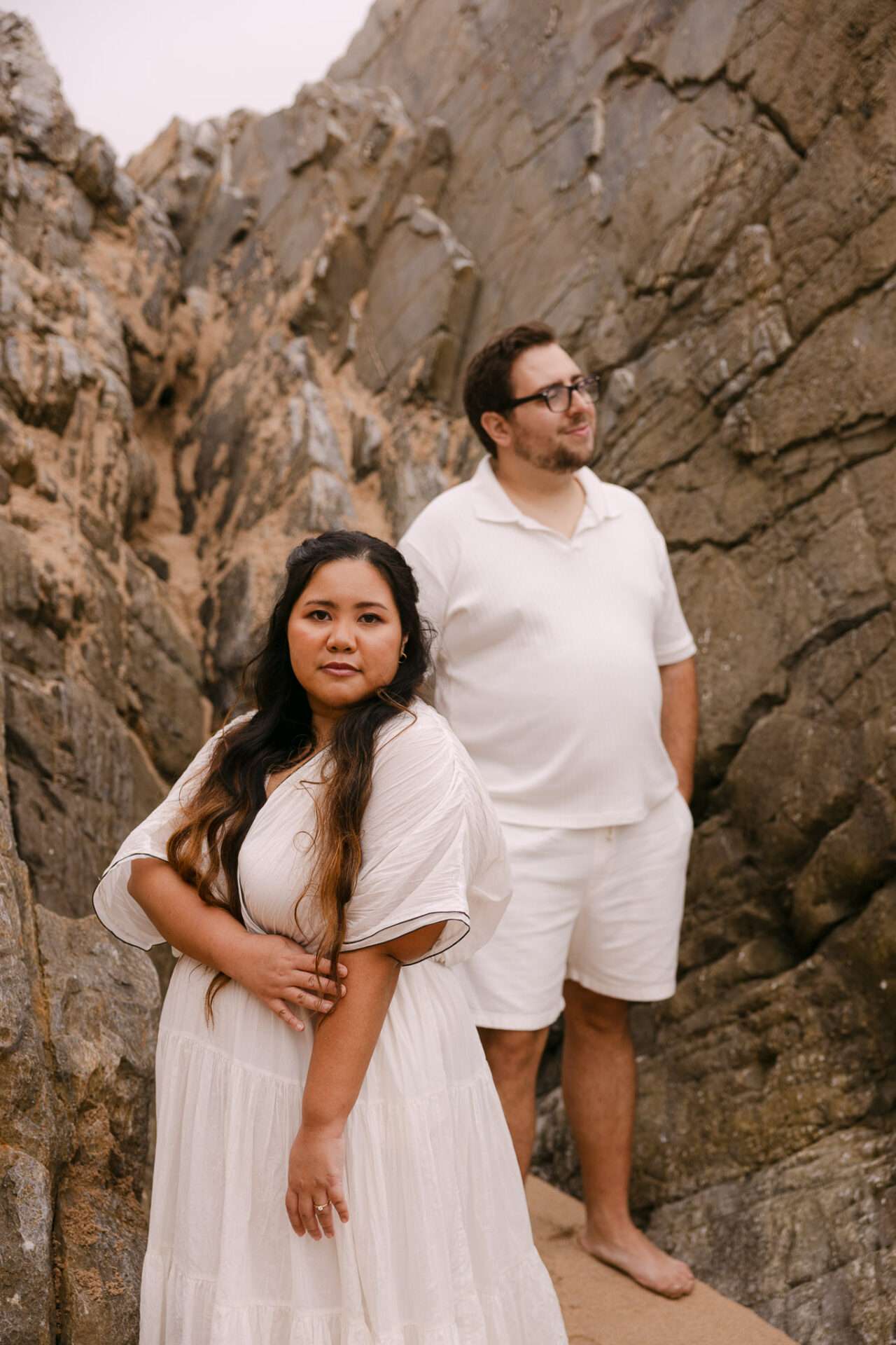 Engagement photographer in Portugal capturing candid beach moments