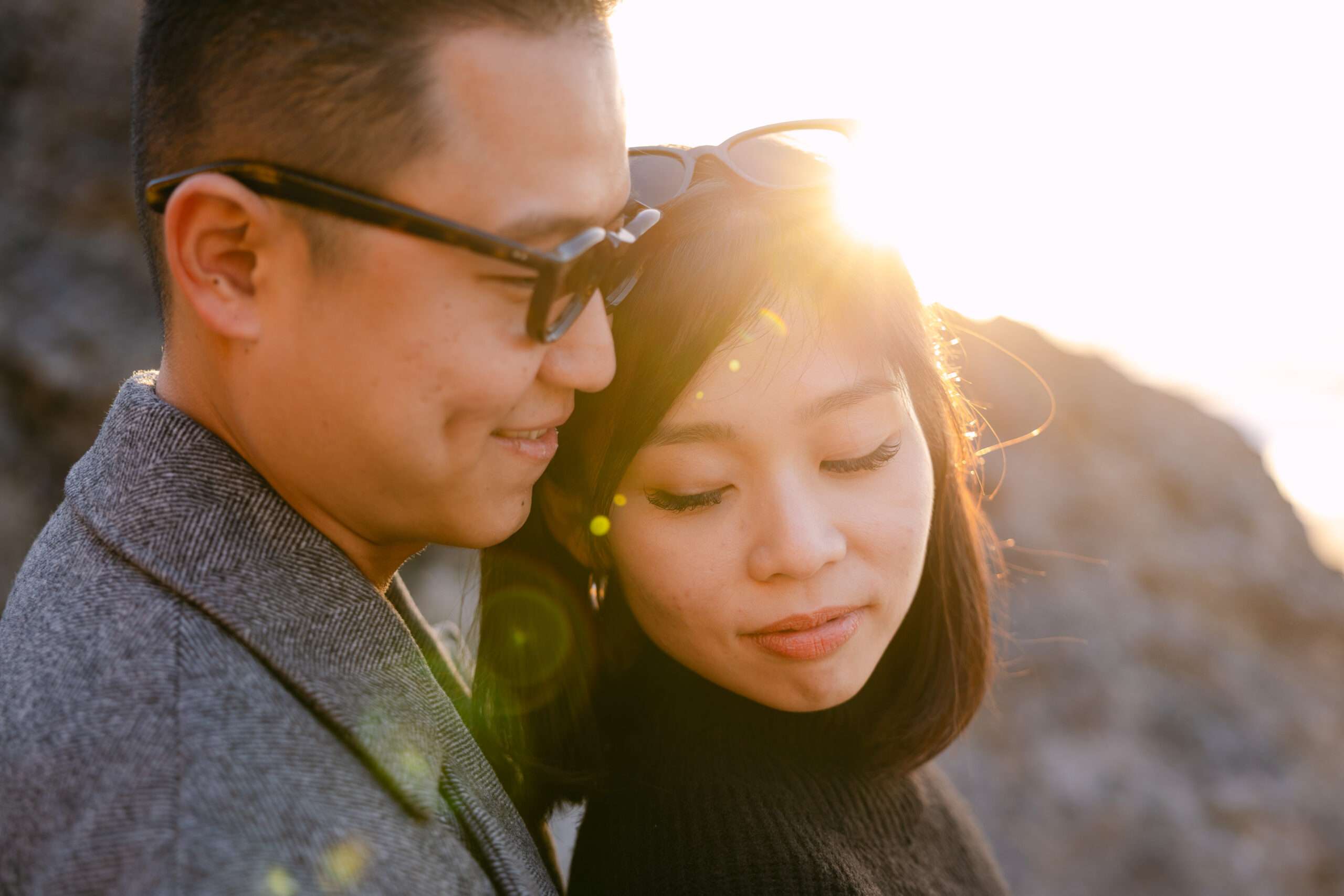 Newly engaged couple hugging at Cabo da Roca cliffs