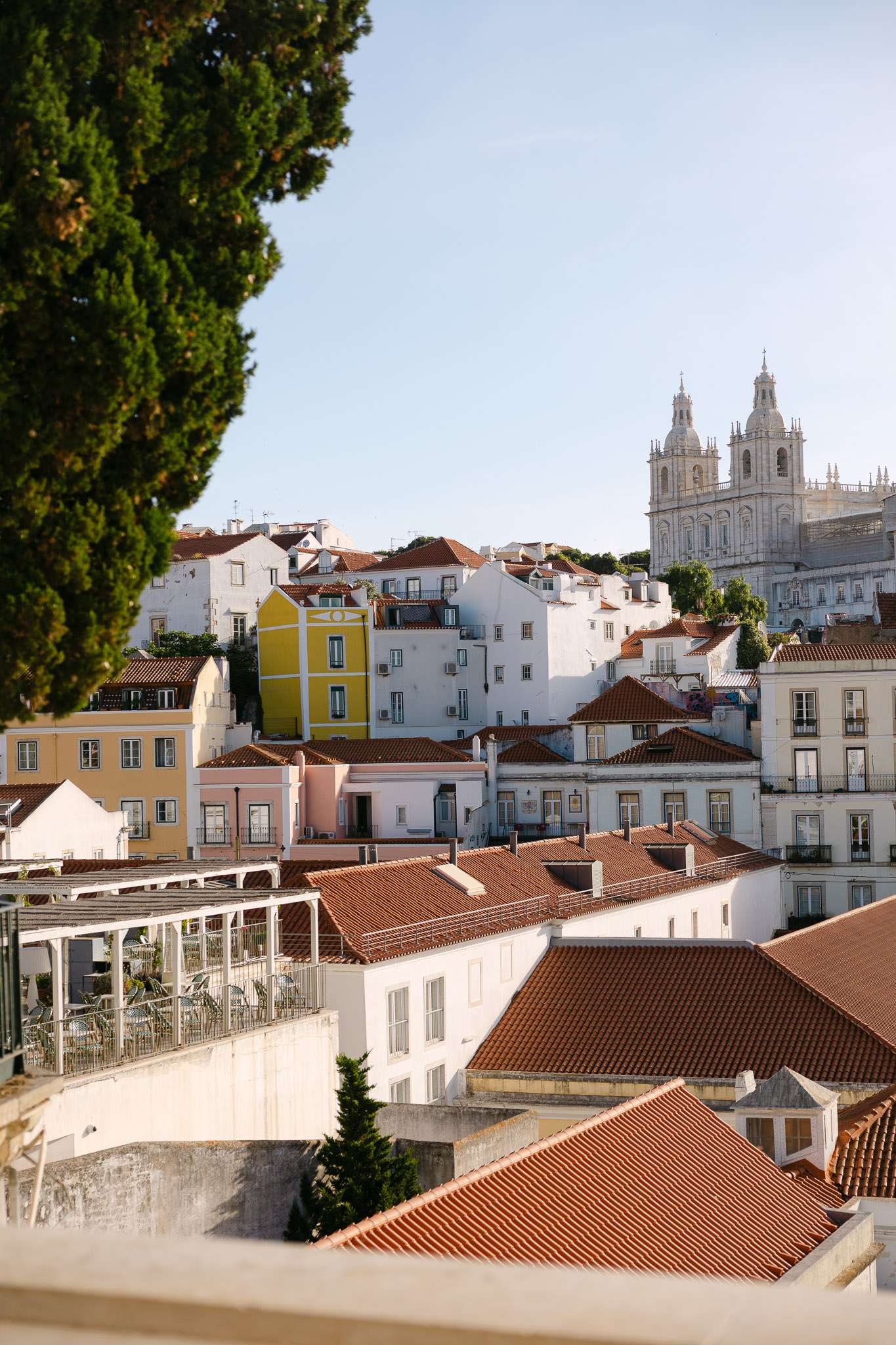 Alfama rooftops and São Vicente de Fora church viewed from miradouro Lisbon, documentary wedding photography Portugal
